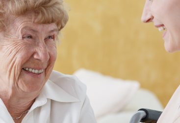 Older woman talking with caretaker